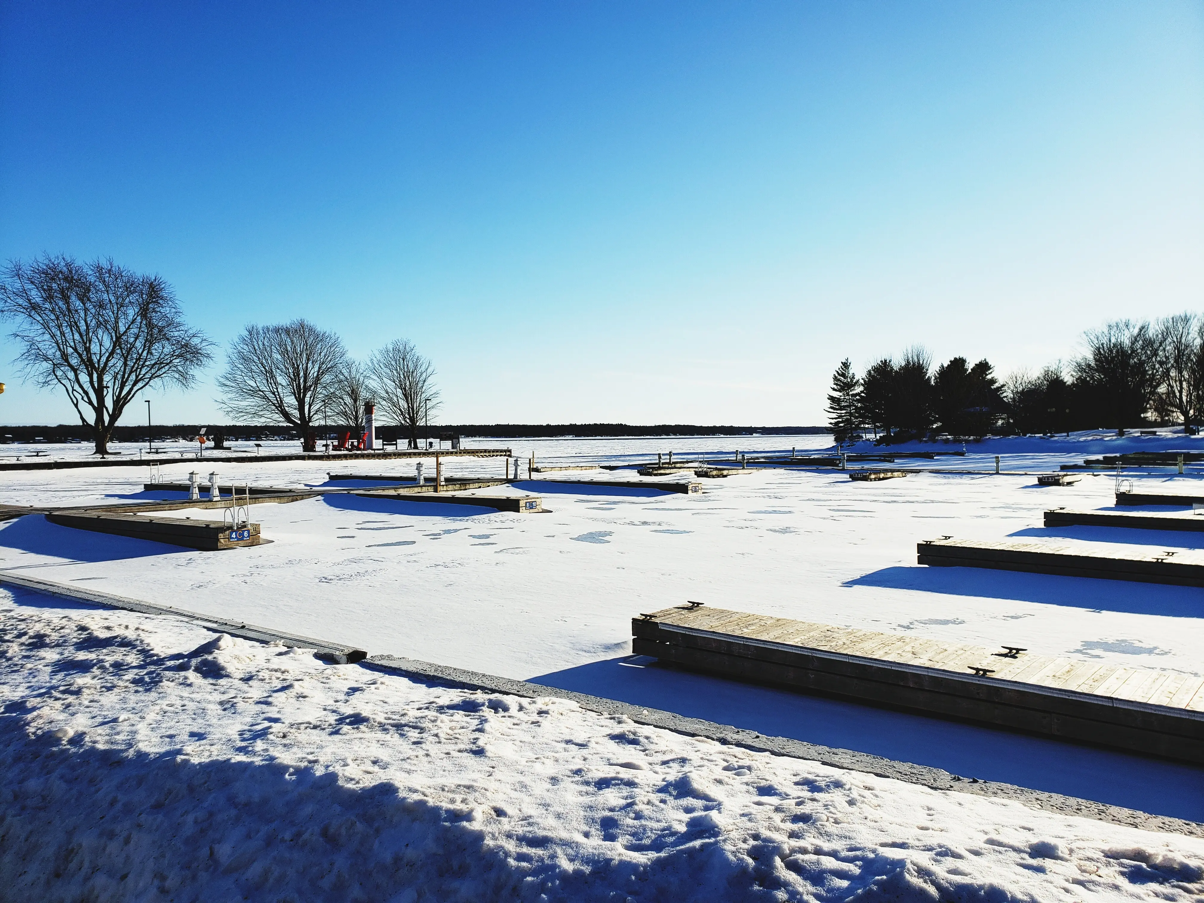 Picturesque view of a snow-covered field beneath a clear blue sky